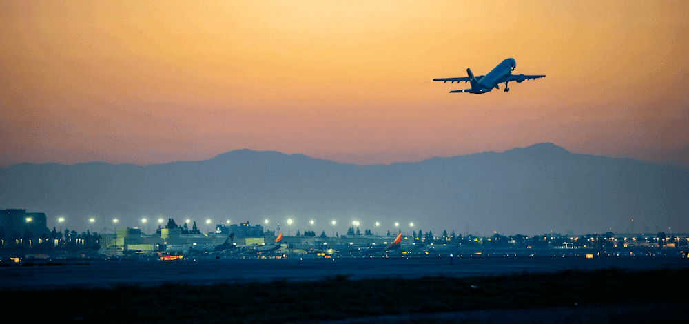Airplane departing at sunset for the journey home